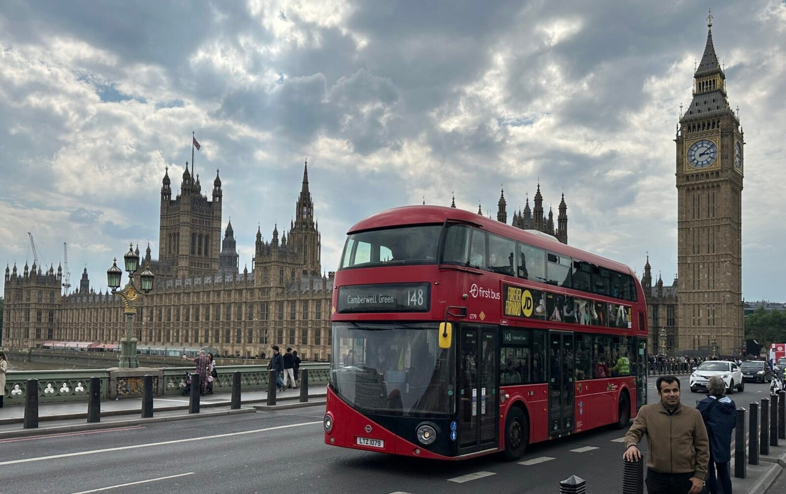 Living cost in UK for Indian students - London bus on Westminster Bridge