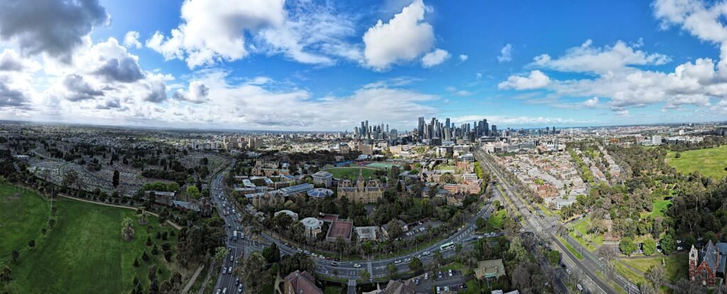 Aerial view of the University of Melbourne with the city skyline, for the guide to masters in Australia for Indian students